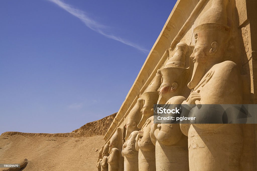 Seven statues look out over the nile luxor west bank  Nile River Stock Photo