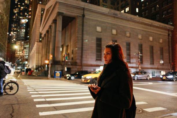 istock waiting for the ride share at night in Manhattan, NY 1183245198