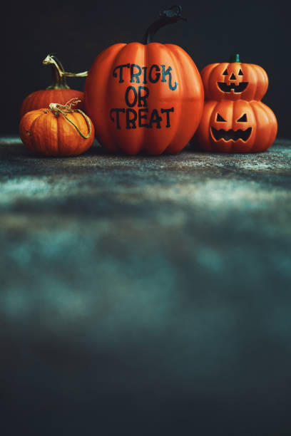 istock Halloween background with Trick or Treat pumpkin and Jack O'Lantern 1183245391