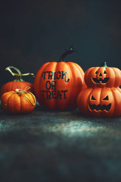 istock Halloween background with Trick or Treat pumpkin and Jack O'Lantern 1183245398
