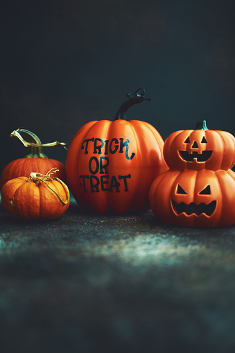 Halloween background with Trick or Treat pumpkin and Jack O'Lantern