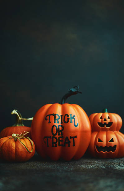 istock Halloween background with Trick or Treat pumpkin and Jack O'Lantern 1183245409