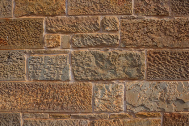 Sandstone block wall background stock photo