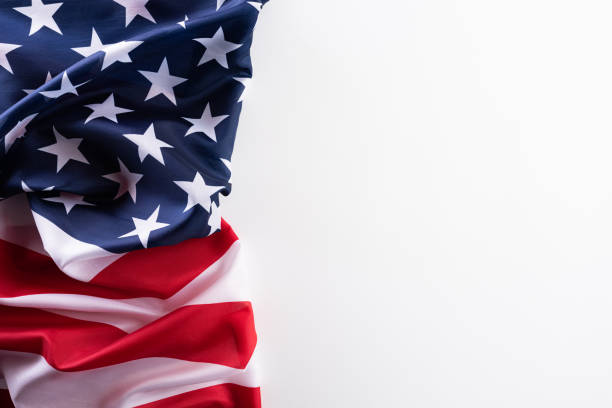 istock Happy Veterans Day. American flags against a white background. 1183252068