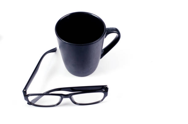 istock Minimalist style with coffee cups and eyeglasses on white backgrounds 1183252248