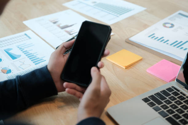 istock male freelancer using mobile smart phone. startup man working at workplace. 1183253372