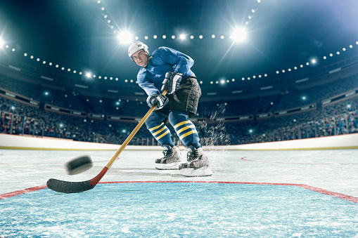 Ice hockey player in action on a professional hockey arena
