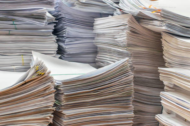 istock pile of paper documents in the office 1183254716