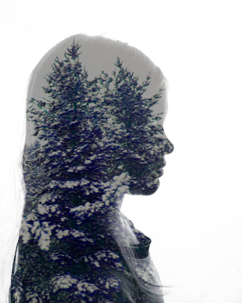 istock Double exposure girl Silhouette with snowy trees 1183257425