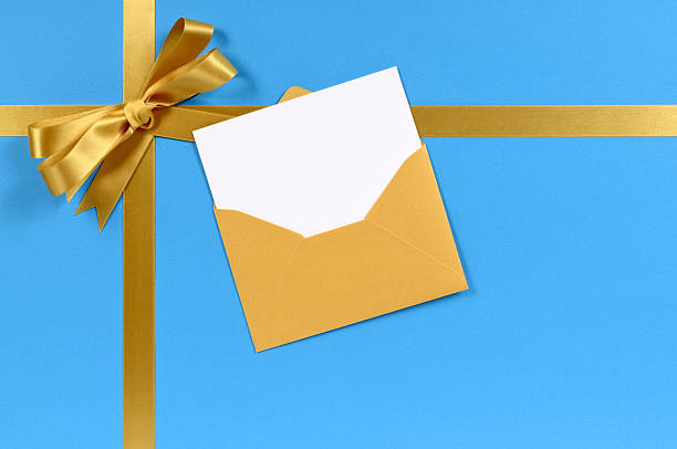 Blue and gold gift with blank greetings card