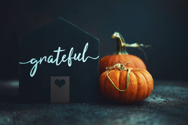 istock Thanksgiving still life with house and pumpkins 1183259793