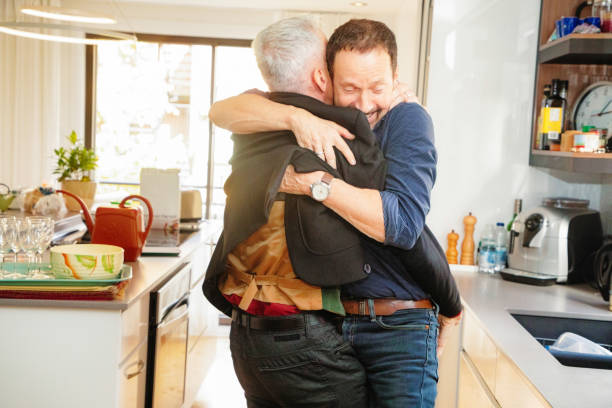 istock Senior gay couple enthusiastically hugging after breakfast 1183270458