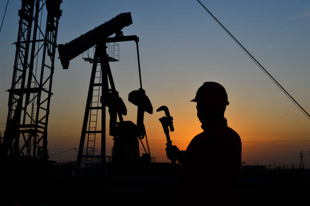 istock The oil workers in the job 1183271378