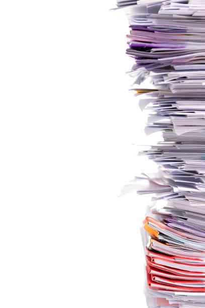 istock Stack of business papers isolated on white background 1183275736