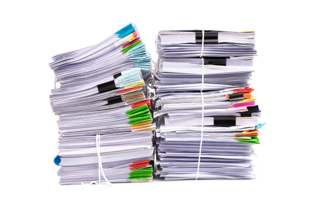 istock Stack of business papers isolated on white background 1183275761