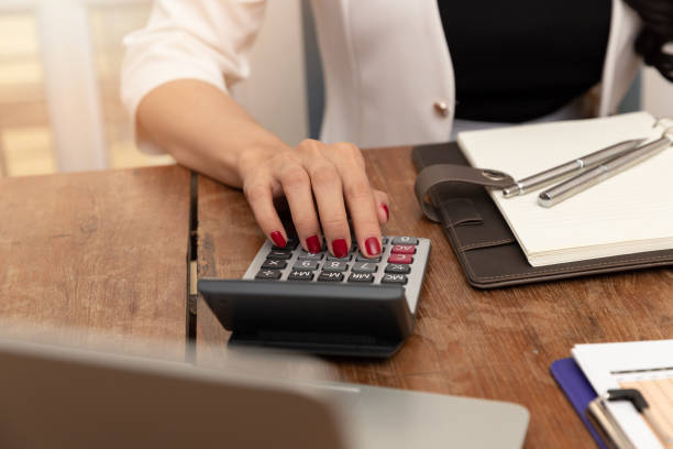 istock Business woman using calculator to calculate bill payment 1183281320