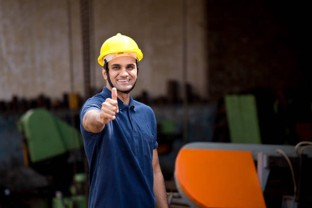 Portrait of young engineer - construction worker indoors