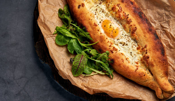 istock delicious Adjarian khachapuri with greens 1183292462