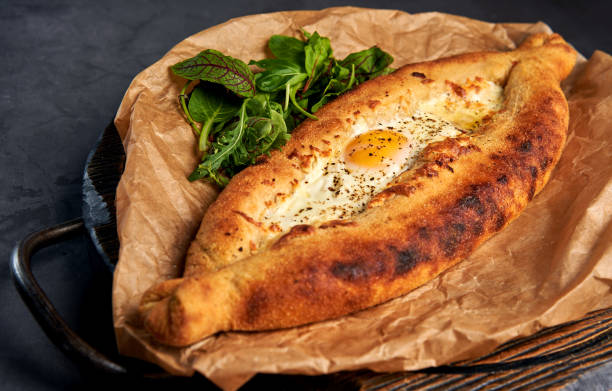 istock delicious Adjarian khachapuri with greens 1183292530