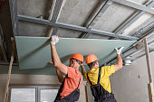 Installation of ceiling drywall.