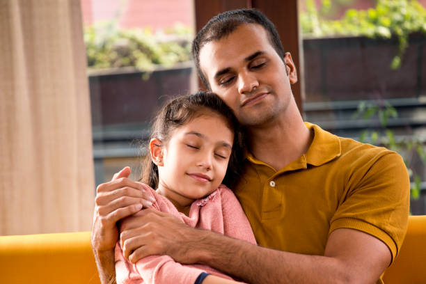 istock Father and daughter sleeping at home 1183298437