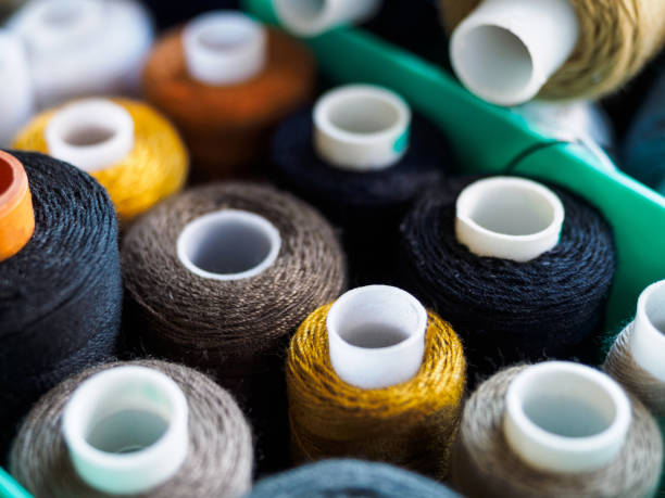 istock Reels with threads of different colors for sewing. Threads located in the box. The view from the top on threads for sewing. 1183299554