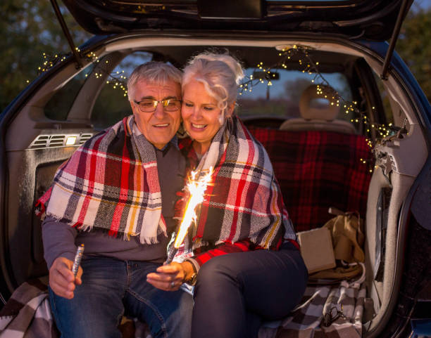 istock Senior couple outdoors with car 1183300624