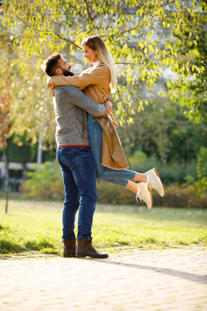 istock Young man holding his girlfriend in arms 1183301776
