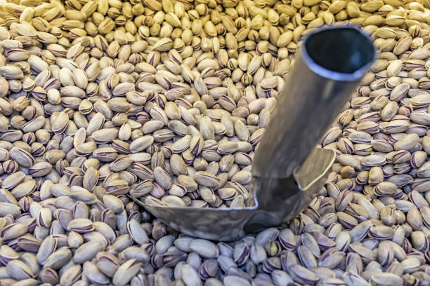 istock close up shelled pistachios in bulk 1183302194