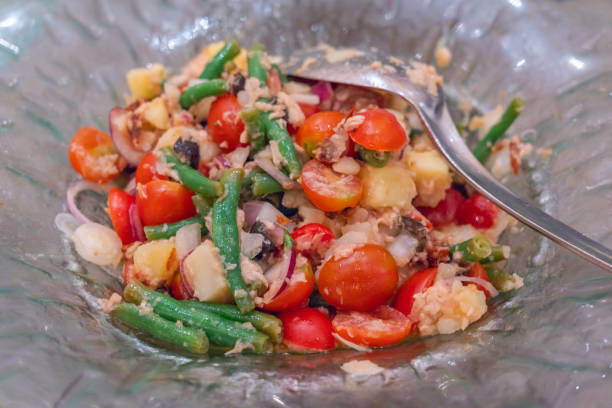 Colorful mixed salad with string beans, tomatoes and onions