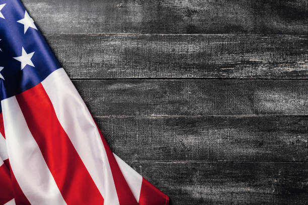 istock American flag on dark background. Flag Veterans Day Concept 1183304488