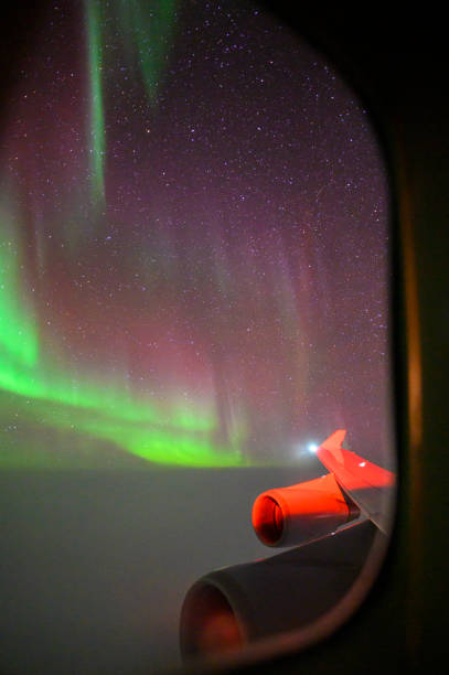 istock Aurora borealis from a jet airliner 1183305297