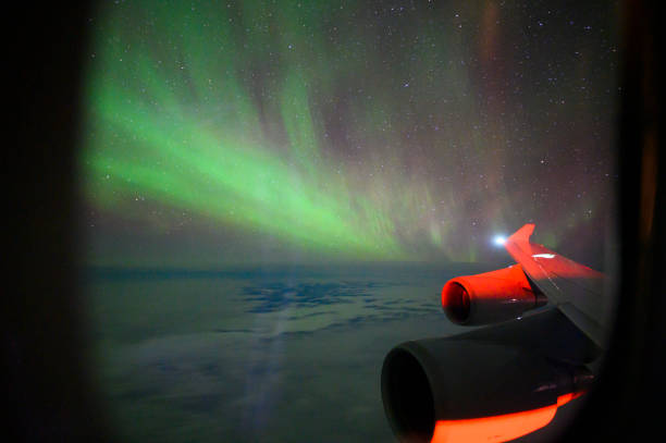 istock Aurora borealis from a jet airliner 1183305330