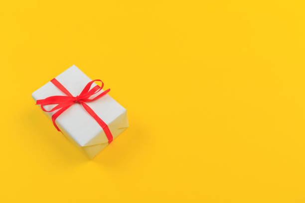 istock Gift box with ribbon and bow on color background and space for text. Top view 1183305679