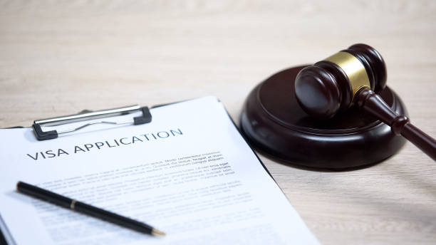 istock Visa application table, gavel lying on sound block, migration law, decision 1183307627