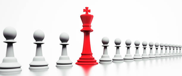 istock Chess Pieces  - Row of white Pawn with red King 1183307926