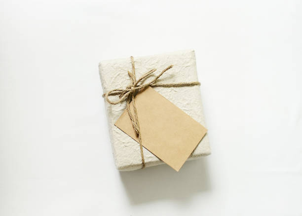 istock gift box with craft card on white light background. 1183309525