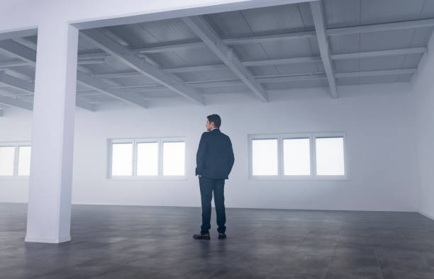 istock Businessman standing in office 1183311559
