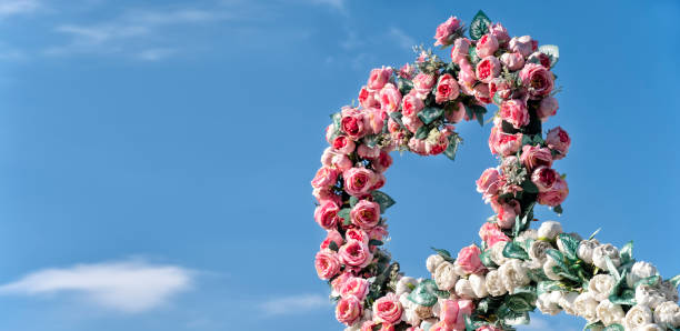 Decoration Of Artificial Roses Decoration Of Artificial Roses With Blue Sky Copy Space hoops wedding stock pictures, royalty-free photos & images