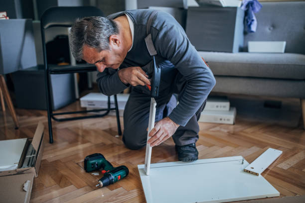 istock Carpenter using drill on furniture 1183315679