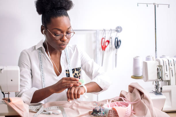 istock sewing fabric with needle at seamstress workplace 1183318492