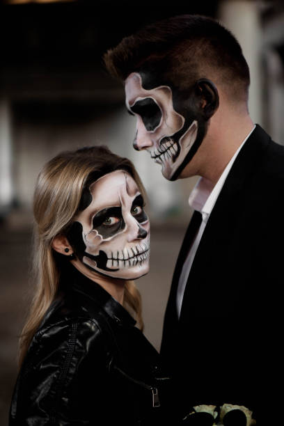 istock Halloween couple. Dressed in wedding clothes romantic zombie 1183318896