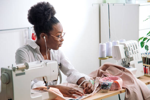 istock sewing fabric with needle at seamstress workplace 1183320298