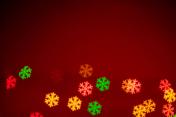 istock Christmas background - snowflakes shaped bokeh 1183320882