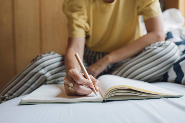 istock A Woman Writing 1183322119