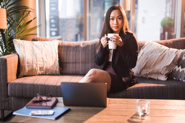 istock Young Asian businesswoman having coffee break. 1183323497