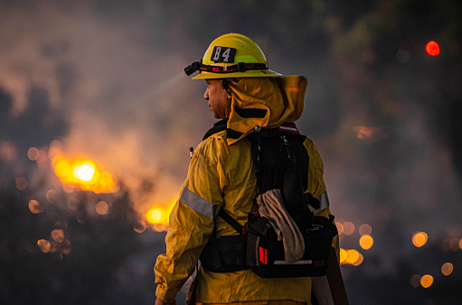 William Riley looks down to the brush fire at Sepulveda Basin on Thursday, Oct. 24, 2019, in Los Angeles, Calif. The fire started out earlier in the afternoon and has caused to burn 50 acres of land.(Photo by Kevin Lendio)