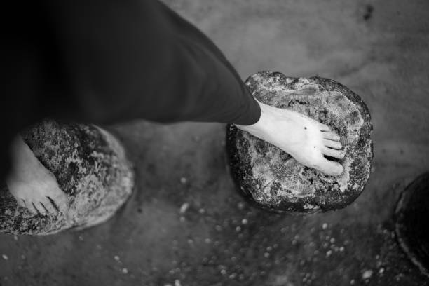 Feet on the beach in black and white