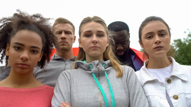istock Group of volunteers angrily looking at camera, protest against harassment 1183326901