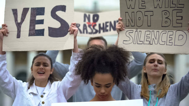 istock Activists crowd fighting against harassment and shouting slogans, human rights 1183326966